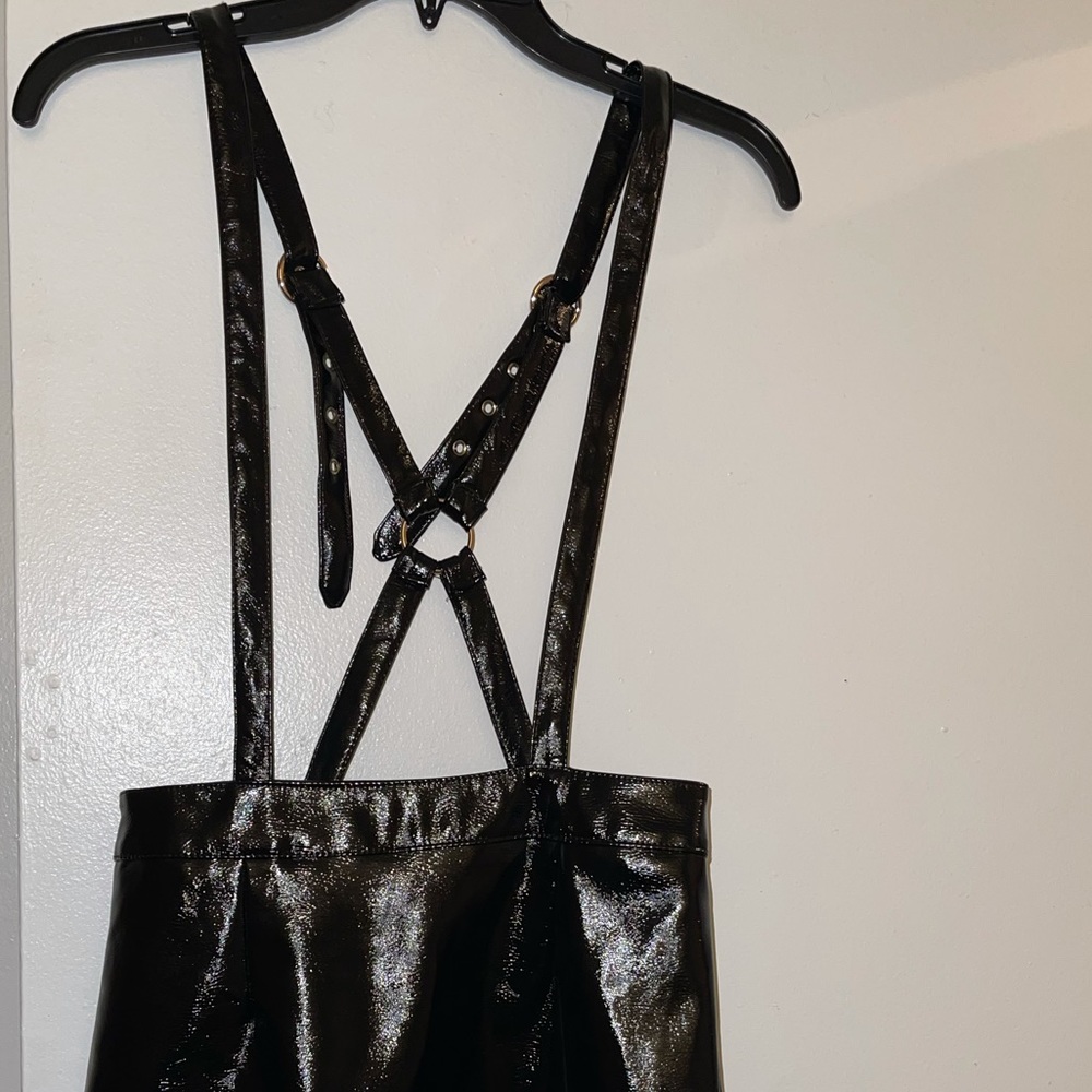 Black Leather mini skirt. Overall style
